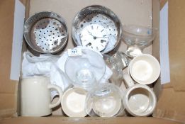 Box of china, sundae dishes and an enamel faced clock movement.