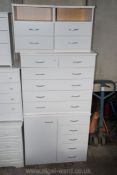 Four piece bedroom suite of two bedside tables, two over four chest of drawers and four drawer unit.