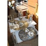 Box of metal ware including an oil lamp, cocktail set, plated trays etc.