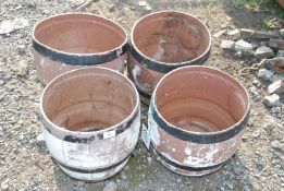 Set of four plastic barrel planters
