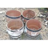 Set of four plastic barrel planters