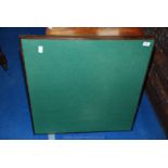 A green baize folding card table.