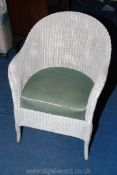A Lloyd Loom style wicker bedroom chair.