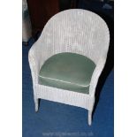 A Lloyd Loom style wicker bedroom chair.