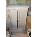 A painted wardrobe with lower drawer, with later added interior shelves,