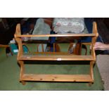 A three shelf pine display stand, 33 1/2" wide x 30" high x 6" deep.