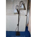 A Twin Tiffany style metal floor lamp.