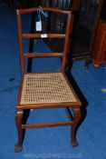 A cane seated ladder back hall chair.