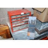 A small set of workshop drawers and part set of drill bits.