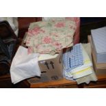 A box of various bed linen, towels, sheets etc.