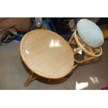Bamboo coffee table with under shelf and cane topped foot stool and cushion 21" high x 23" diameter.