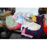 A large quantity of bedding, tea towels, blankets, two car rugs, crochet etc.