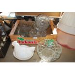 Box of various glass dishes, sundae set and a hen on nest.