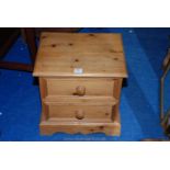 A two drawer bedside cabinet.