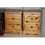 A pair of pine two drawer Bedside cupboards with pull-out shelves
