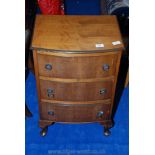A three drawer bedside cabinet.