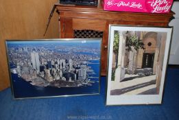 A print on board of a cityscape and a contemporary Art print.
