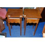 A pair of oak occasional tables with drawers, 24" high x 14" wide x 14" deep.