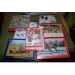 A collection of 8 new jigsaw puzzles.
