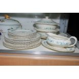 A Myott dinner service having two lidded vegetable dishes, gravy boat and saucer, a meat plate,