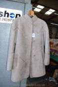 A 'Yeovil' ladies sheepskin coat, tan/grey, size 14.
