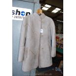 A 'Yeovil' ladies sheepskin coat, tan/grey, size 14.