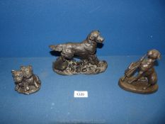 Three bronze coloured Heredities dogs including Golden Retriever, Boxer and Westie pup.