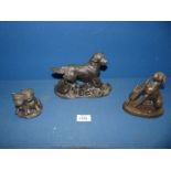 Three bronze coloured Heredities dogs including Golden Retriever, Boxer and Westie pup.