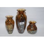 A set of three iridescent Okra cut glass vases with trailed black lines, Orion art glass pattern,
