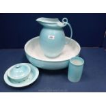 A Royal Doulton pale blue five piece Bedroomware set to include; wash jug, bowl, soap dish,