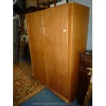 A 1950/60's G-Plan style light Oak finished Wardrobe,