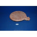 An old Indian red sandstone chapati board,