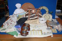 A box of miscellanea to include Smiths Bakelite clock, wooden animal table mats, Zebra skin handbag,
