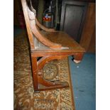 An Oak solid seated Side Chair of ecclesiastic flavour,