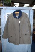 A three quarter length brown Coat with black collar, two front pockets, by Baronia, size 12/14.