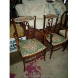 A pair of Edwardian Mahogany framed open armed Elbow Chairs having most unusual assymetericall