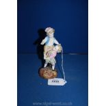 A 19th century Sitzendorf figurine of two children playing a climbing game. 6 1/4" tall.
