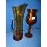 An amber glass jug made in Poland, 14" tall together with an amber twisted stem glass/vase,