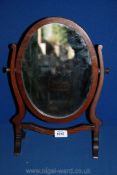 An oval Mahogany toilet Mirror, circa 1900.