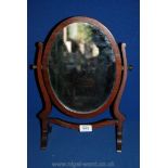 An oval Mahogany toilet Mirror, circa 1900.