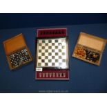 Two complete travel Chess sets with boards, one wood, the other glass and a Dominoes box.
