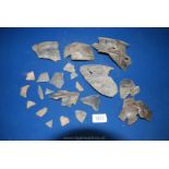 An interesting box of ancient pottery shards mainly with raised or moulded decoration,