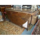 A good heavy period Oak dropleaf, swing leg peg joined Dining Table standing on turned legs,