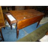 A Victorian Mahogany Pembroke Table having a drawer to one end and standing on turned legs with