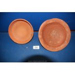 Two Roman Samian Ware dishes one with incised decoration to the outer rim;