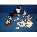 A quantity of dog ornaments including Spaniels and a Collie.
