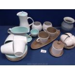 A quantity of Poole Pottery Tableware including cups and saucers, sauce jug, saucer, coffee pot etc.