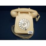 A vintage cream telephone.