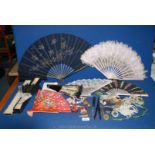 A quantity of miscellanea including basket of costume jewellery, fans, glove stretchers, purse, etc.