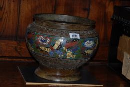An antique Chinese bronze and champleve Jardiniere decorated with butterflies and peonies, 23 cm.
